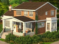 a large house with lots of windows and porches