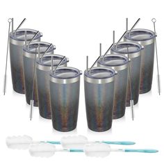 six stainless steel tumblers with straws and toothbrushes next to each other