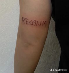 a person with a tattoo on their arm that reads,'reaum '