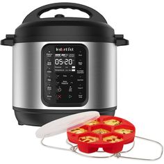 an instant pot with four mini muffins in it and thermometer next to it