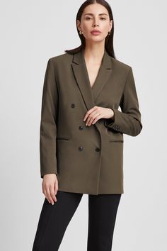 Meet the modern classic. The relaxed tailoring of our Norah Blazer will make her your elevated everyday staple for work or play. Fashioned from soft, European polyviscose and featuring myriad thoughtful details, she offers a lapel collar, clean pockets, a slit at the back, and a double-breasted button fastening, so you can wear her open or closed. Her padded shoulders lend additional structure.[SPLIT] Maritza, in black, is 5'9.5" (177 cm) tall, wearing size XS. Julia, in olive, is 5'10" (178 cm) Relaxed Tailoring, Social Impact, Fitted Blazer, The A Team, Double Breasted Blazer, Black Blazers, Lapel Collar, Modern Classic, French Terry