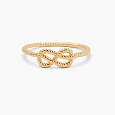 Discover the perfect blend of traditional marine style and modern sophistication with our one-of-a-kind Crew Ring. Expertly crafted from solid gold and elegantly designed with a nautical look, it's the perfect accessory for any occasion. Dare to be different - wear the Crew Ring and turn heads with its bold, unique style. Available in 14k gold plated brass Band width: 1mm Protected with an anti-tarnish barrier SKU: BYR1094 Adjustable 14k Gold Midi Rings For Formal Occasions, Elegant Gold Midi Rings With Infinity Shape, Elegant Gold Infinity Midi Rings, Adjustable Gold Plated Rings For Formal Occasions, Adjustable Infinity Ring For Formal Occasions, Luxury Gold Infinity Ring, Gold Infinity Ring For Formal Occasions, Adjustable Yellow Gold Midi Rings For Formal Occasions, Classic Gold Infinity Ring