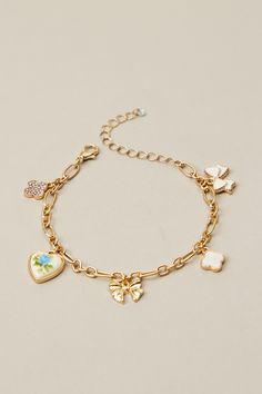 This charm bracelet features a dainty floral heart and bow pendant that will add a sweet touch of elegance to any outfit. What To Get Bestie For Christmas, Multi Charm Bracelet, Charm Friendship Bracelet, Dainty Charm Bracelet, Christmas Wishlist Ideas Aesthetic, Christmas Charm Bracelet, Charm Bracelet Ideas, Cute Charm Bracelets