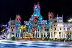 an ornate building lit up with colorful lights