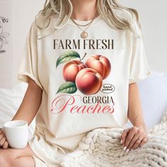 Embrace summer vibes with our Fresh Peaches T-shirt! Made from soft organic cotton, this unisex tee features a fun peach fruit graphic. Perfect for casual wear and peach lovers alike. Enjoy eco-friendly fashion that's stylish and comfortable. Grab this unique tee and show your love for all things peachy! 🍑 About Our Product: ⭐ 1. Comfort Colors 1717 Garment-Dyed Shirt Details: Made with 100% ring-spun U.S. cotton (6.1 oz/yd softened for comfort. Double-needle stitching for durability, seamless Fruit T Shirt, Fruit Graphic, Dark Botanical, Fresh Peaches, Peach Fruit, Eco Friendly Fashion, Summer Fruit, Graphic Shirt, Personalized Shirts