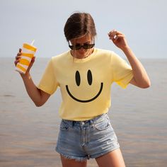 You will love this vintage happy face tshirt! These smiley tees are so soft and comfortable so they're great for lounging at home or running around doing errands! These retro smile face shirts make great gifts for your bestie, daughter, sister or anyone who loves giving off happy, positive vibes! These t-shirts are not made as an oversized fit so please make sure to check the size chart and order up a few sizes if you are looking for that baggier fit! *PRODUCT DESCRIPTION* -Bella+Canvas 3001 Unisex Jersey Short Sleeve Tee -100% cotton (fiber content may vary for different colours) -Light fabric -Tear-away label -Shirt colour may vary slightly due to variations in lighting and monitor brightness *SIZING* -Retail fit (slightly fitted) -Runs true to size -See size guide in product photos for Smiley Face Shirts, Vintage Smiley Face, Aesthetic Smile, Yellow Tshirt, Smiley Face Tshirt, Label Shirt, Fiesta Shirt, Smiley Face Shirt, Happy Smiley Face