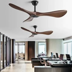 the ceiling fan is hanging from the ceiling in an office