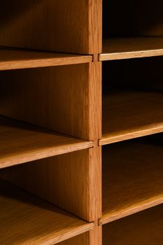 an empty wooden bookcase with no one in it