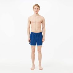 These color-block taffeta swim shorts with contrasting stripe details are perfect for swimming or waterside relaxation. Made from quick-drying fabric, featuring a drawstring waist, handy pockets, and a matching branded bag. Sporty Athletic Shorts For Pool, Sportswear Swim Trunks For Summer, Sporty Short Swim Trunks For Pool, Sporty Nylon Swimwear For Poolside, Sporty Go-dry Swimwear For Poolside, Summer Sportswear Swim Trunks With Elastic Waistband, Sportswear Swim Trunks With Elastic Waistband For Summer, Sporty Go-dry Swim Trunks For Poolside, Sporty Go-dry Swim Trunks For Water Sports