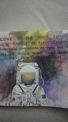 a piece of paper with an image of an astronaut on it and the words love is the only thing that we're capable to prevent