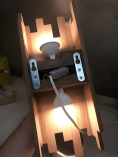 a light that is on top of a wooden shelf