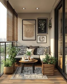 a living room filled with lots of furniture and plants on top of a wooden floor