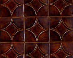 a close up view of a brown ceramic tile