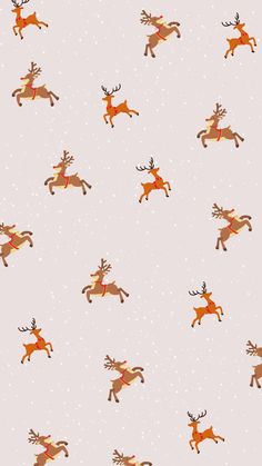 an image of reindeers in the snow on a white background with red and orange colors