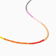 Transition your look into summer with our Color Block Beaded Necklace. Featuring green, yellow, orange, red, peach, pink, purple, gray, and blue beads, this necklace really has it all. For a full vacation-approved look, pair this colorful necklace with anything from our beaded jewelry collection. Colorful Round Beads Beach Necklace, Colorful Beaded Necklaces For Vacation With Round Beads, Colorful Beaded Necklaces For Beach, Colorful Beaded Chain Beads For Beach, Colorful Beaded Necklaces With Round Beads For Vacation, Colorful Beaded Chain For Beach, Multicolor Tiny Beads Strand, Trendy Multicolor Necklaces For Vacation, Trendy Multicolor Necklace For Vacation