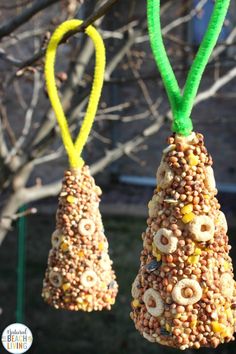 two bird feeders made out of cereal krispy kreme treats