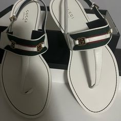 Gucci Thong Sling Back Flat Sandal. White Leather With Gucci Red N Green Ribbon Worn Once Size 8. Gucci Designer Sandals With Single Toe Strap, Designer Gucci Sandals With Single Toe Strap, Luxury White Sandals With Single Toe Strap, Gucci Designer Slingback Sandals, Designer Gucci Slingback Sandals, Gucci Leather Slingback Sandals, Luxury Gucci Slingback Sandals, Luxury White Flat Sandals, White Gucci Sandals With Branded Insole