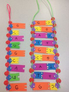 some colorful paper clips with letters and numbers on them