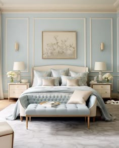 a bedroom with blue walls and white furniture