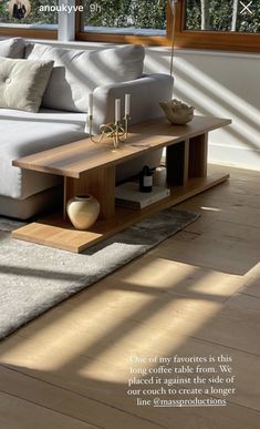 a large white couch sitting on top of a wooden floor