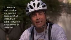 a man wearing a bicycle helmet with a quote on it