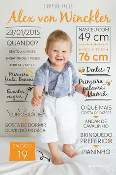 a little boy standing on top of a bed in front of a white wall with orange lettering