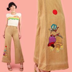 Vintage 1970's Embroidered Bell Bottoms *Magical Mushrooms, Butterfly, Ants, Sun, Caterpillar & Daisies Embroidered Details! *High Waisted + Big Bells *Vintage 100% Cotton // No Stretch *Insane Vintage Find! SIZE: Fits like a modern size 25, with 36  max hips--  please use measurements below to make sure it's a good fit for you: Waist: 26 inches (sits slightly below true waist) Rise: 12  inches Hips: 36 inches Upper Thigh: 22  inches Inseam: 29 inches Color: Heathered Tan + Rainbow Multi Brand: Vintage , no label present Material: 100% Cotton Condition: Excellent Vintage Condition If you *LoVe* this piece - Check out our other items! Please convo us with any questions. It is the buyer's responsibility to review our store policy page for important information regarding Payment, Shipping, an Hippie Jeans, Flower Power Hippie, Vintage Clothing Boutique, Flower Pants, Patchwork Jacket, Vintage Rainbow, 1970s Fashion, Embroidered Details, Bell Bottom Pants