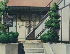 the stairs lead up to an apartment building with plants growing on it's sides