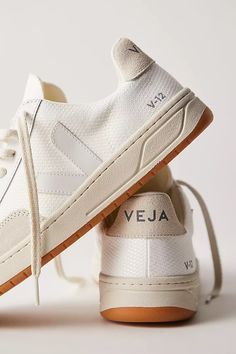 Veja V-12 Sneakers | Free People Trendy Shoes For Women Boots, In Style Shoes For Women, Work Wear Sneakers, Vejas And Dress, 2024 White Sneakers, Veja Street Style, Shoes For Europe Travel Summer, Fall 2024 Sneaker Trends Women, Italy Shoes Women