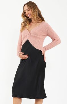 Made from a luxurious woven viscose satin, the Crystal Satin Maternity Skirt with its bias cut and semi-fitted silhouette ensure a graceful flow with every step. The fabric and the elastic band waist make this pull on skirt extremely comfortable to wear, and the shape is extremely flattering as it skims the hips and gently flares out to a flowing hem. It has movement whilst still giving shape, and doesn't cling. A piece that is easy to dress up or down for the office or the weekend, and can be t Pregnant Wedding Guest Outfits, Maternity Evening Wear, Pregnant Party Dress, Maternity Evening, Maternity Two Piece, Maternity Lounge Wear, Maternity Nightwear, Maternity Dresses For Baby Shower, Formal Maternity Dress