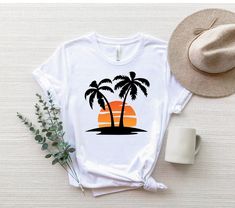 "Retro Tropical Sunset Shirt, Sunset And Palms Shirt, Palm Tree T-Shirt, Palm Beach Shirt, Sunset Beach Tee, Summer Shirt, Nature T-Shirt ☀️☀️☀️☀️☀️ Everything in our shop is hand crafted and made to order. If you want different color or size contact me! If you would like something custom made to fit your personal style please message me and I will do everything to get you that something special. ---How To Order--- ⭐️Please, check and review all photos ⭐️Choose your t-shirt size and color ⭐️Ente Palm Tree Shirt Design, Beach Shirts Vinyl, Tree Shirt Design, Summer Gif, Palm Tree Shirt, Retro Tropical, Sunset Shirt, Tropical Sunset, Beach Tee