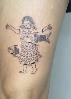 a woman with a fish tattoo on her thigh is standing in front of the camera