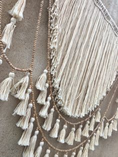 several tassels hanging on the side of a wall