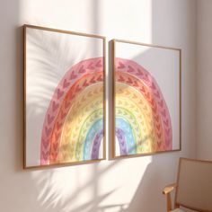 there is a rainbow painting on the wall next to a chair in front of it