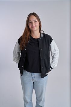 Channeling timeless style and effortless cool, the Adult Varsity Jacket is inspired by classic sportswear with a modern twist. Featuring a sleek black and grey design, this jacket offers warmth and comfort for everyday wear. Perfect for matching with your mini, it's a stylish way to stay cozy while adding a touch of nostalgia to your wardrobe. Whether you're on the go or relaxing, this versatile piece will quickly become a go-to favorite! ITEM BECOMES FINAL SALE IF PATCHES HAVE BEEN APPLIED Mate Black Outerwear With Pockets For College, College Style Black Outerwear With Pockets, Black College Style Varsity Jacket With Pockets, Winter Campus Long Sleeve Outerwear, Long Sleeve Winter Campus Outerwear, Black Long Sleeve Varsity Jacket With Pockets, Black Long Sleeve Varsity Jacket For Winter, Casual Winter Varsity Jacket For Campus, Fall Campus Long Sleeve Outerwear