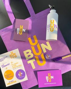 a purple bag with the words bun run on it next to other items including a pen