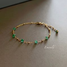 * DETAILS * This dainty natural emerald bracelet is a perfect gift to the one you love or to yourself. A nice every day bracelet. - Genuine Faceted Zambian Emerald Beads - 24K Gold Filled Chain - 14K GOLD FILLED Wire - 14K Gold Filled Bead Cap - 14K Gold Filled Lobster Clasp - 14K Gold Filled Link Rings ✨All components are gold filled. 👉🏻For more gemstone bracelets, see https://www.etsy.com/shop/JinnysJewelryBySeJin 🌟 You may also like Emerald necklace. https://www.etsy.com/JinnysJewelryBySeJ Dainty Green Beaded Bracelets For Everyday, Delicate Green Bracelet As Gift, Dainty Green Bracelets For Everyday, Dainty Green Everyday Bracelets, Dainty Bracelets With May Birthstone For Everyday, Minimalist Green Bracelet For Everyday Wear, Handmade Everyday Bracelets For May Birthstone, Handmade Everyday Bracelet For May Birthstone, Adjustable Emerald Bracelet As A Gift