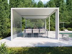 an outdoor dining area with white furniture and trees in the backgroung, next to a swimming pool