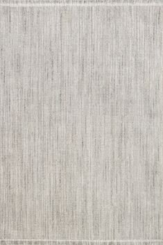 an area rug with white and grey stripes