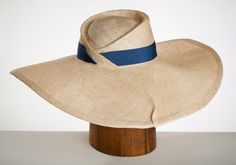 Gatsby-Elegant Large Brimmed Sculpted Straw Hat. Luxury Curved Brim Sun Hat For Beach, Luxury Curved Brim Hat For The Beach, Luxury Curved Brim Hat For Beach, Luxury Curved Brim Beach Hat, Luxury Curved Brim Panama Hat For Beach, Luxury Wide Brim Panama Hat For Kentucky Derby, Luxury Curved Brim Straw Hat For Kentucky Derby, Luxury Boater Hat With Curved Brim For Kentucky Derby, Chic Curved Brim Top Hat For Beach