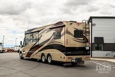 a large motor home parked in a parking lot