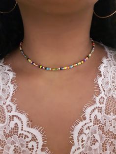 "Rainbow Bead Choker - Stretch Bead Choker - Rainbow Beaded Choker - Seed Bead Choker - Boho Bead Choker - Dainty Beaded Choker - Seed Choker - Elastic Choker - Stretchy Choker - Rainbow Beaded Necklace - Beach Choker * D E T A I L S * This choker is made with size 8 Seed Beads and is finished with a Silver Lobster Clasp and also comes with a 2 inch extender chain.  * S I Z E * This choker is avaliable in the following sizes: 11 inches 11.5 inches  12 inches  12.5 inches 13 inches  13.5 inches Colorful Heishi Beads For Festival, Multicolor Letter Beads For Jewelry Making, Colorful Letter Beads For Festival, Bohemian Letter Beads For Jewelry Making, Bohemian Letter Beads For Crafting, Festival Multicolor Letter Beads, Colorful Heishi Letter Beads, Rainbow Beaded Necklace, Miyuki Bead