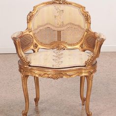 an ornately decorated chair sits on the floor