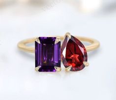 an image of two rings with different colored stones on them, one is yellow gold and the other is amethyst purple