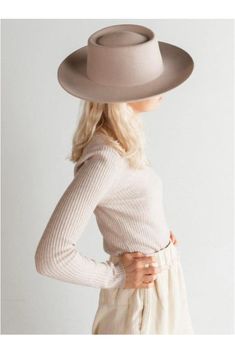 Your favorite women's gambler style felt hat with an updated brim, we love the new Ginger. With a slightly curled up brim and telescope crown, the Ginger in Ivory is one of the most fashionable hats to reach the shelves of Gigi Pip. This neutral gambler hat has the perfect blend of stiffness added to it and is ready to wear, well anywhere. The Ginger has a front of crown height of 9 cm and a brim width of 9 cm brim width. Great for a classic ivory hat look. The Ginger is made of 100% Australian Gambler Hat Gigi Pip, Felt Hat Blonde Hair, Ivory Hat, Gambler Hat, Gigi Pip, Crown Heights, Felt Hat, Hat Fashion, Panama Hat