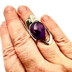 This Stunning Vintage Modernist Women's Ring By Hallmarked Is A Size 6.5 Sterling Silver Piece Adorned With A Beautiful Purple Amethyst Stone. Its Modernist Design Adds A Unique Touch To Any Outfit. Brand: Hallmarked Color: Purple, Silver Size: 6.5 Style: Modernist For: Women Material: Sterling Silver, Amethyst Features: Modernist Size: Womens Size 6 Condition: Pre-Owned Like New Vintage And Or Estate Jewelry Items. These Items Are Preowned Items And May Have Been Previously Worn. These Jewelry Modern Amethyst Ring As Gift, Modern Polished Silver Gemstones, Polished Amethyst Ring For Anniversary, Polished Amethyst Anniversary Ring, Modern Amethyst Anniversary Ring, Modern Sterling Silver Amethyst Ring With Polished Finish, Modern Silver Amethyst Gemstone Ring, Sterling Silver Amethyst Open Ring, Formal Amethyst Open Ring