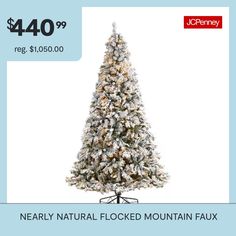 a fake christmas tree with white lights and snow on the top is for $ 40 99