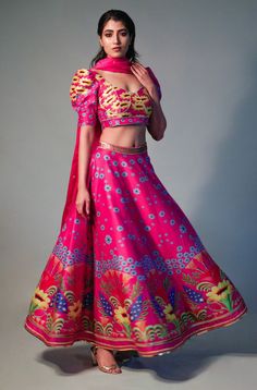 Editor's Note Pink Printed Lehenga Set Handcrafted In Cotton Silk (chanderi) With Hand Painted Motifs Printed On A Chanderi Base. The Blouse Has Sweetheart Neckline And Puff Sleeves. This Lehenga Comes With Satin Organza Dupatta Adorned With Hand Embroidery Detailing Color: Pink Fabric: Chanderi Care: Dry Clean Only About the Designer Saksham & Neharicka make modernizing Indian wear with rich handwoven textiles, fresh intricate textures, chic and classic silhouettes, Saksham & Neharicka handcraf V Neck Lehenga, Destination Wedding Colors, Lehenga Pattern, Printed Lehenga, Net Embroidery, Embroidery Detailing, Hand Woven Textiles, Organza Dupatta