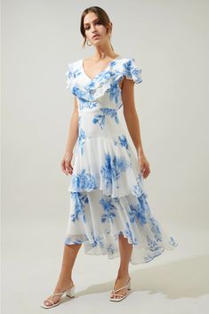 Dreams come true in the Meliza Midi. Ruffle layers sweep from shoulder to shoulder to create a shallow V neckline. The dress maintains a sleek fit throughout the waist and hips. Ruffle tiers are layered atop each other to create an ethereal midi skirt. Pair the look with simple accessories and strappy heels for the perfect wedding look. Runs true to size. Midi Dres, Kimono Sweater, Simple Accessories, Blouse Tank Top, Wedding Look, Church Dresses, Curvy Dress, Wedding Mood, The Perfect Wedding