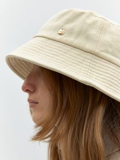 Editor's NotesDEPOUND presents a collection inspired by 'L'Oiseau bleu', offering warm and cozy items with happiness. - Bucket hat style- Stitching detail on the brim- Mini circular metal logo on the size- Made of thick cotton fabric- Classic and warm mood Measurements(in.)One Size- Circumference: 23.23 in. Composition & Care- Material: 100% Cotton- Natural leather may have fine scratches and wrinkles- Bright leather can get stained by denim or dark outfits- Pen and bond marks Cream Bucket Hat With Flat Brim, Beige Bucket Hat For Everyday, Beige Sun Hat One Size Fits Most For Everyday, Cream Flat Brim Sun Hat For Everyday, Everyday Cream Flat Brim Sun Hat, Everyday Cream Sun Hat With Flat Brim, Beige Short Brim Bucket Hat For Everyday, Cream Bucket Hat For Everyday, Cream Wide Brim Bucket Hat For Everyday